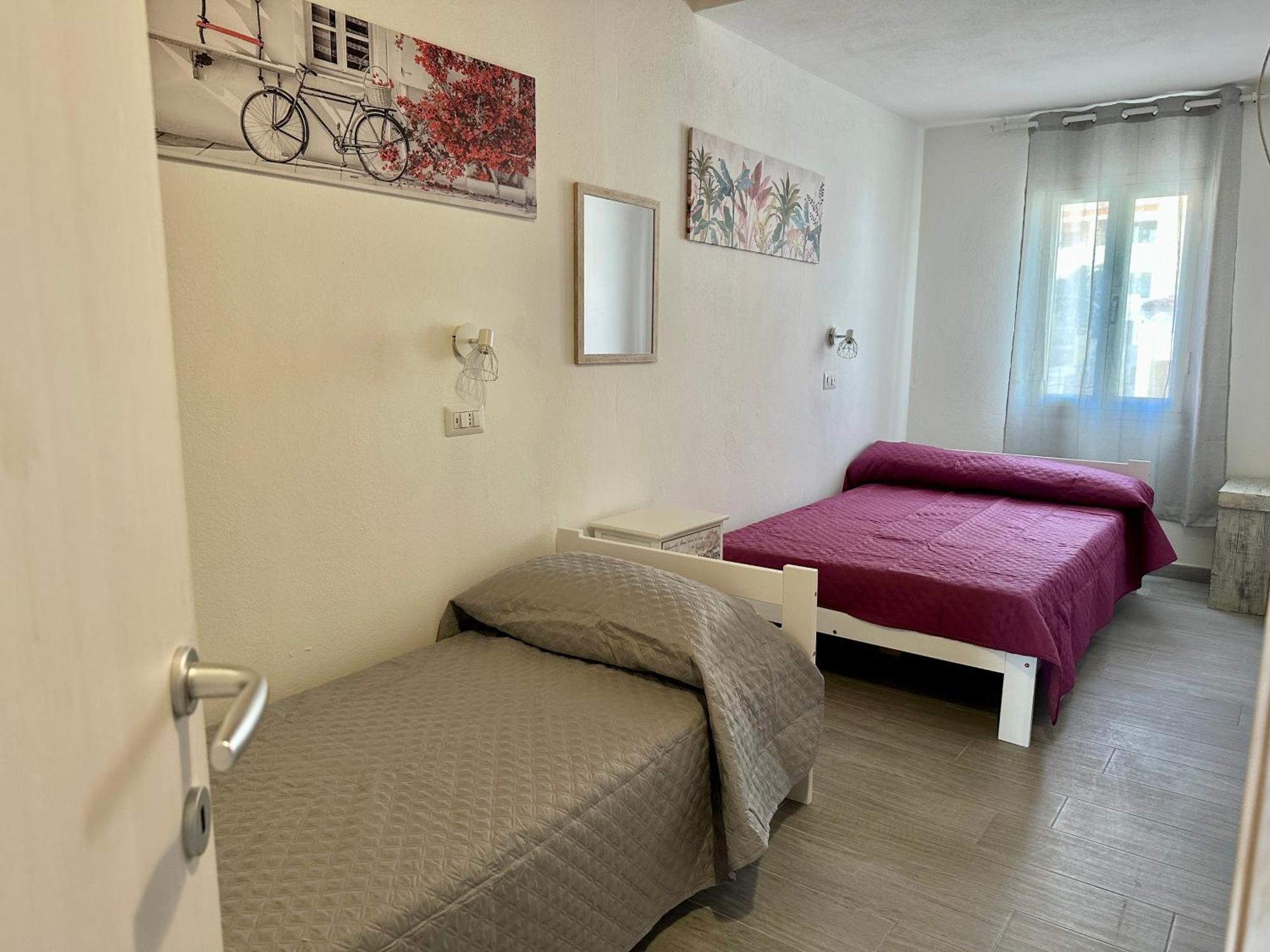 Approdo Apartments Isola Rossa Exterior photo